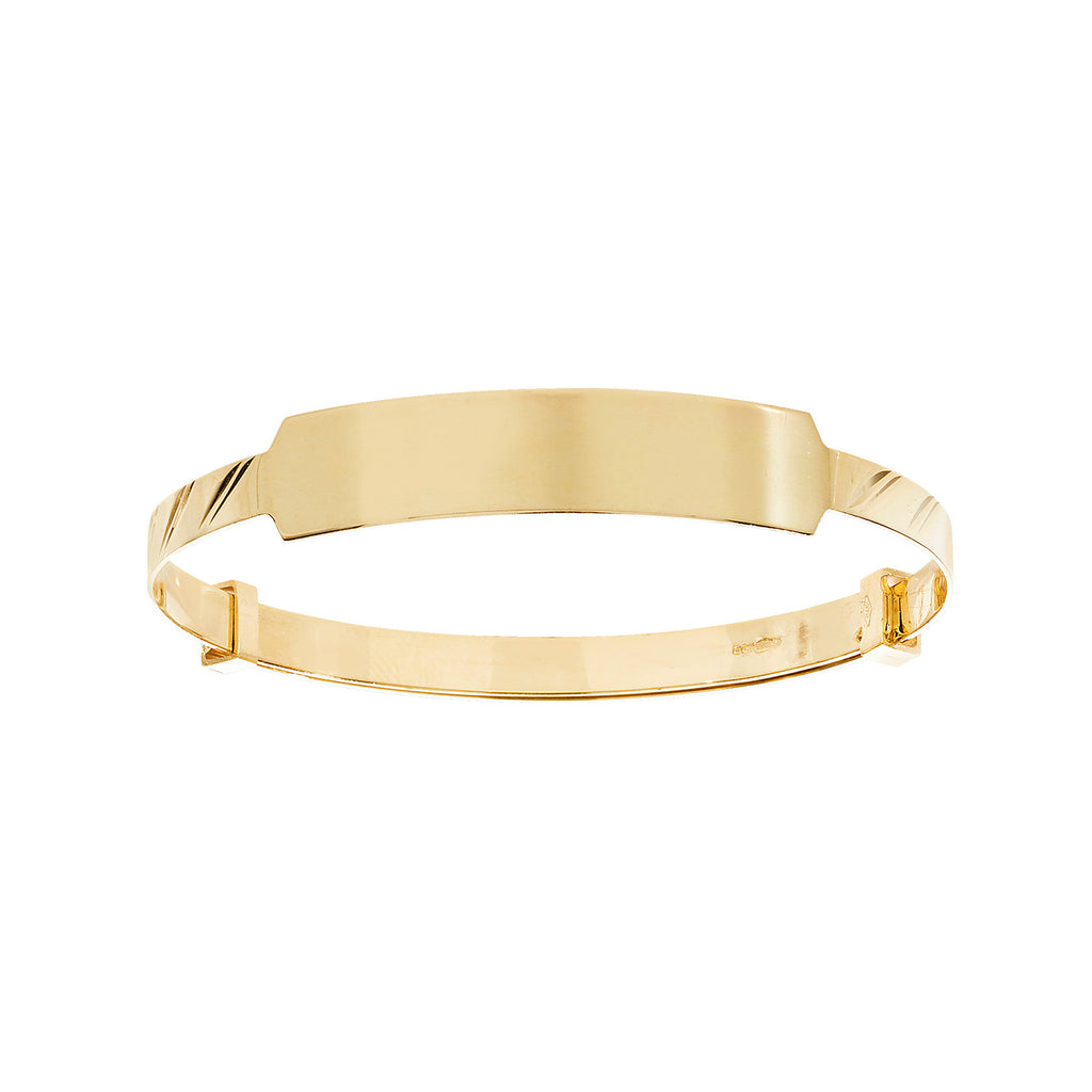 Wide ID baby bangle with diagonal-cut pattern in yellow gold