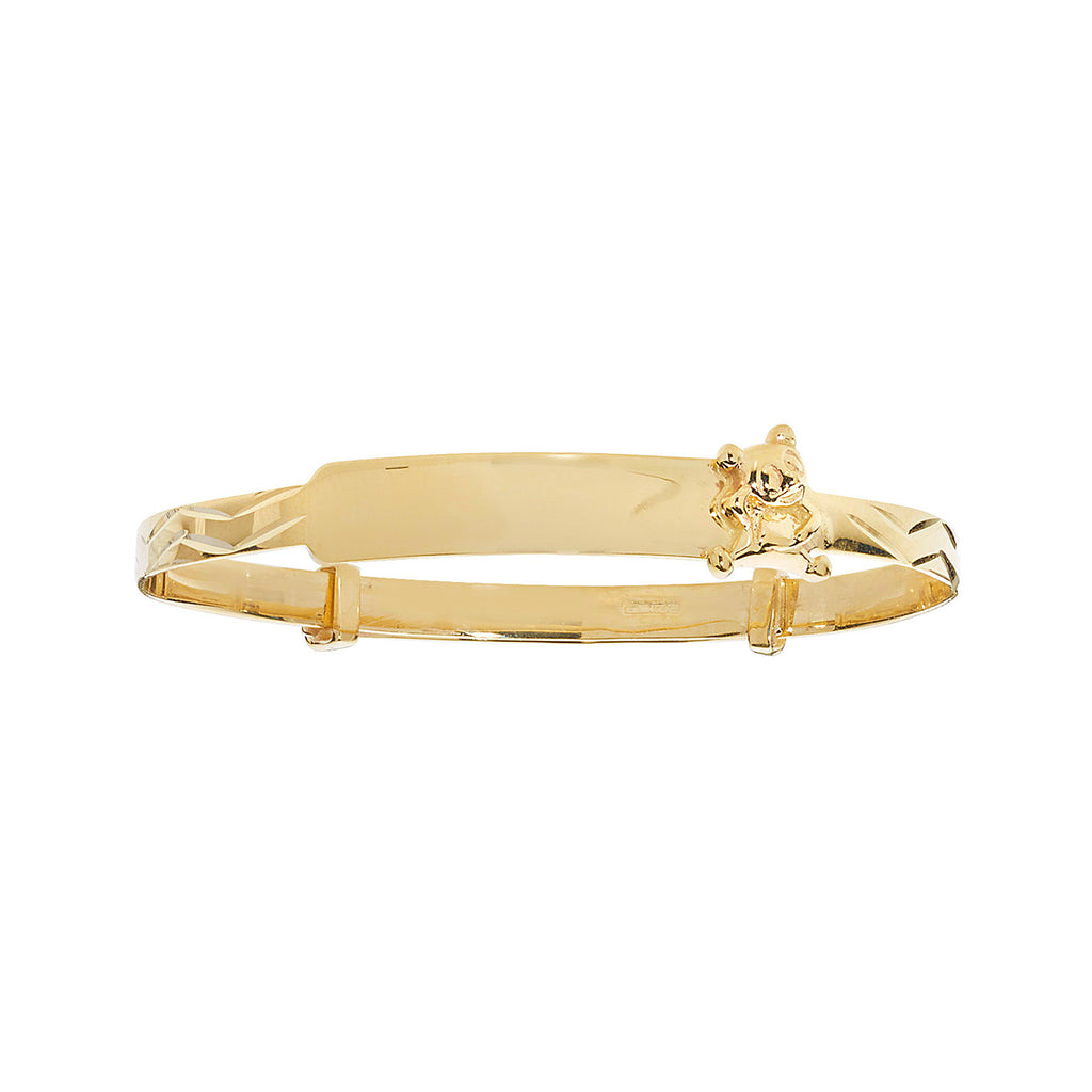 ID baby bangle with teddy bear charm in yellow gold